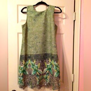 Perfect summer dress.  Sleeveless and intricate details at hem.